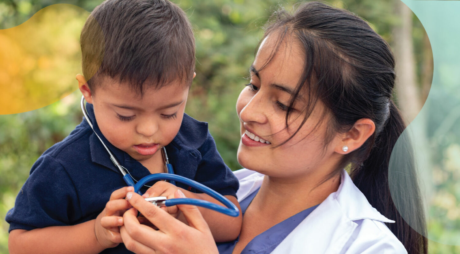 young asian boy with Down syndrome wearing stethescope, being held by asian female doctor