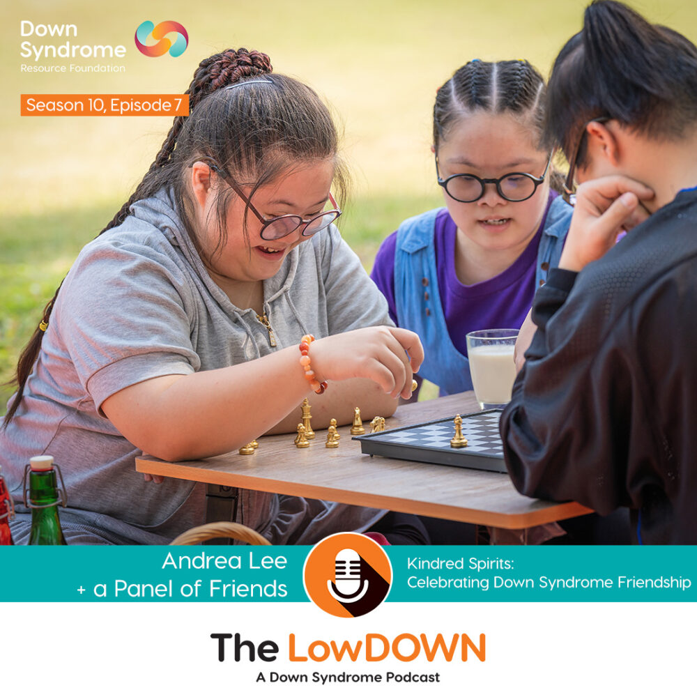 3 Asian teenagers (2 female, 1 male), play chess in a park